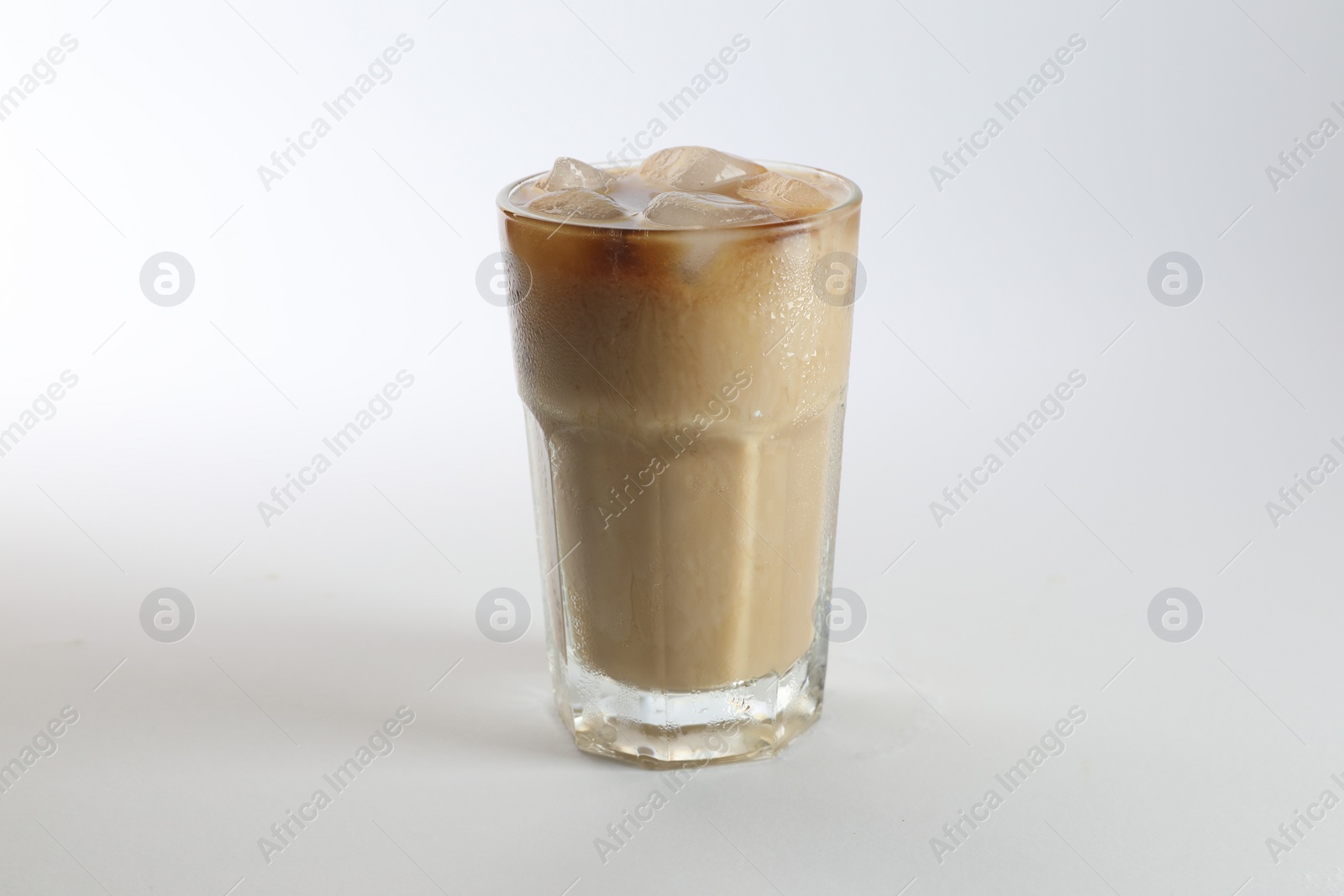 Photo of Iced coffee in glass on white background