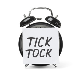 Alarm clock and sticky note with words TICK TOCK on white background. Time concept