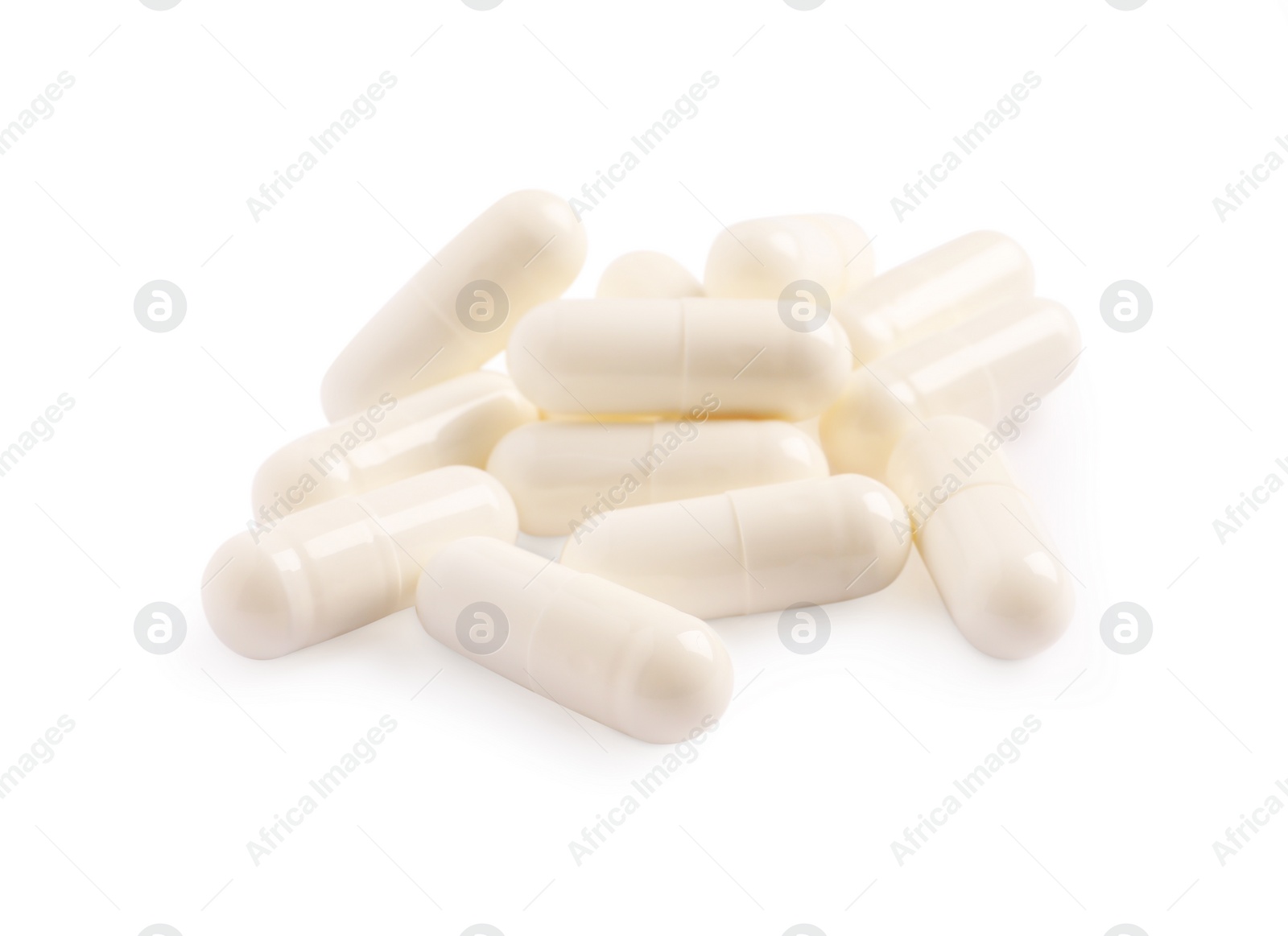 Photo of Many pills isolated on white. Medicinal treatment