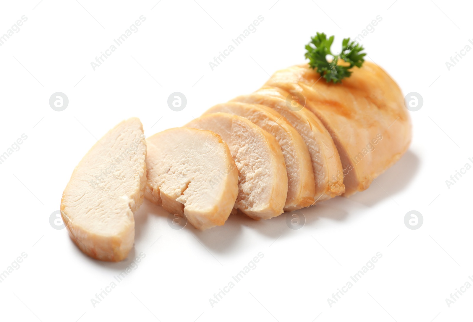 Photo of Partially cut fried chicken breast with parsley on white background