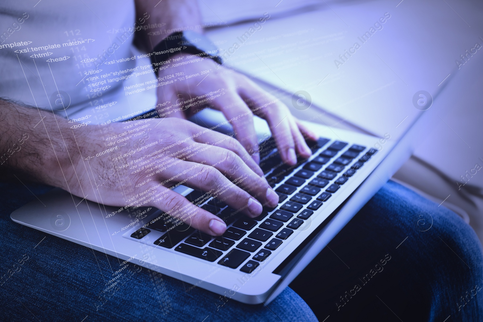 Image of Hacker working with laptop indoors, closeup. Cyber attack