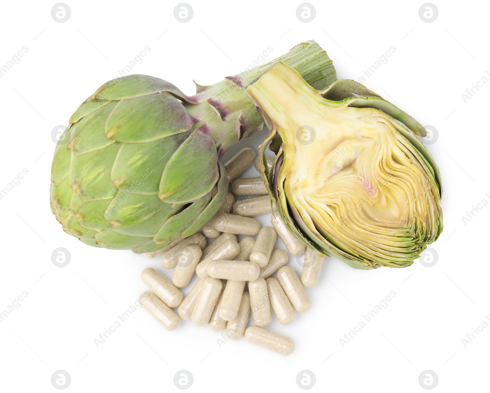 Photo of Fresh artichokes and pills isolated on white, top view