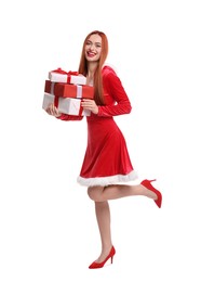 Photo of Young woman in red dress with Christmas gifts on white background