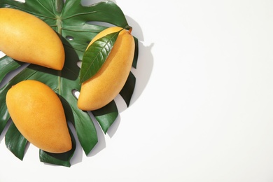 Photo of Composition with fresh mango fruits on white background, top view. Space for text