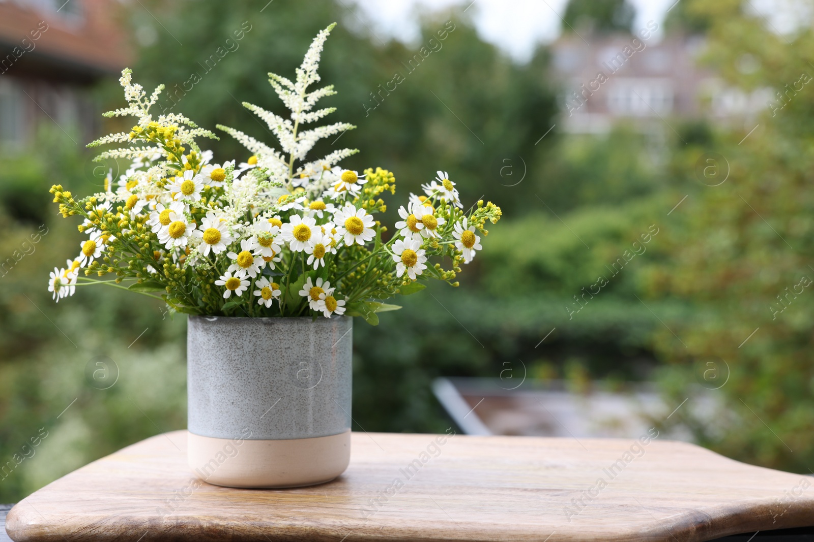 Photo of Bouquet of fresh flowers outdoors. Space for text