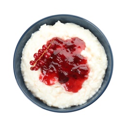 Photo of Creamy rice pudding with red currant and jam in bowl on white background, top view