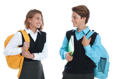 Photo of Happy pupils in school uniform on white background