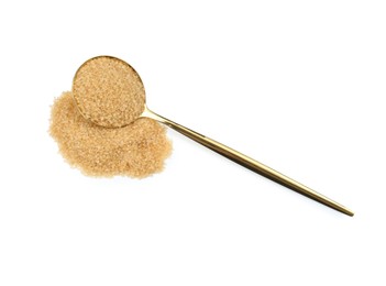 Pile of brown sugar and spoon isolated on white, top view