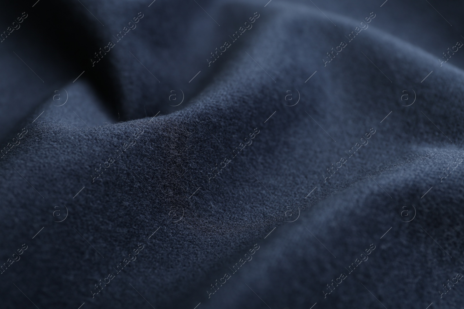 Photo of Texture of dark blue fabric as background, closeup