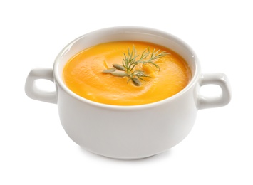 Delicious pumpkin cream soup in bowl on white background