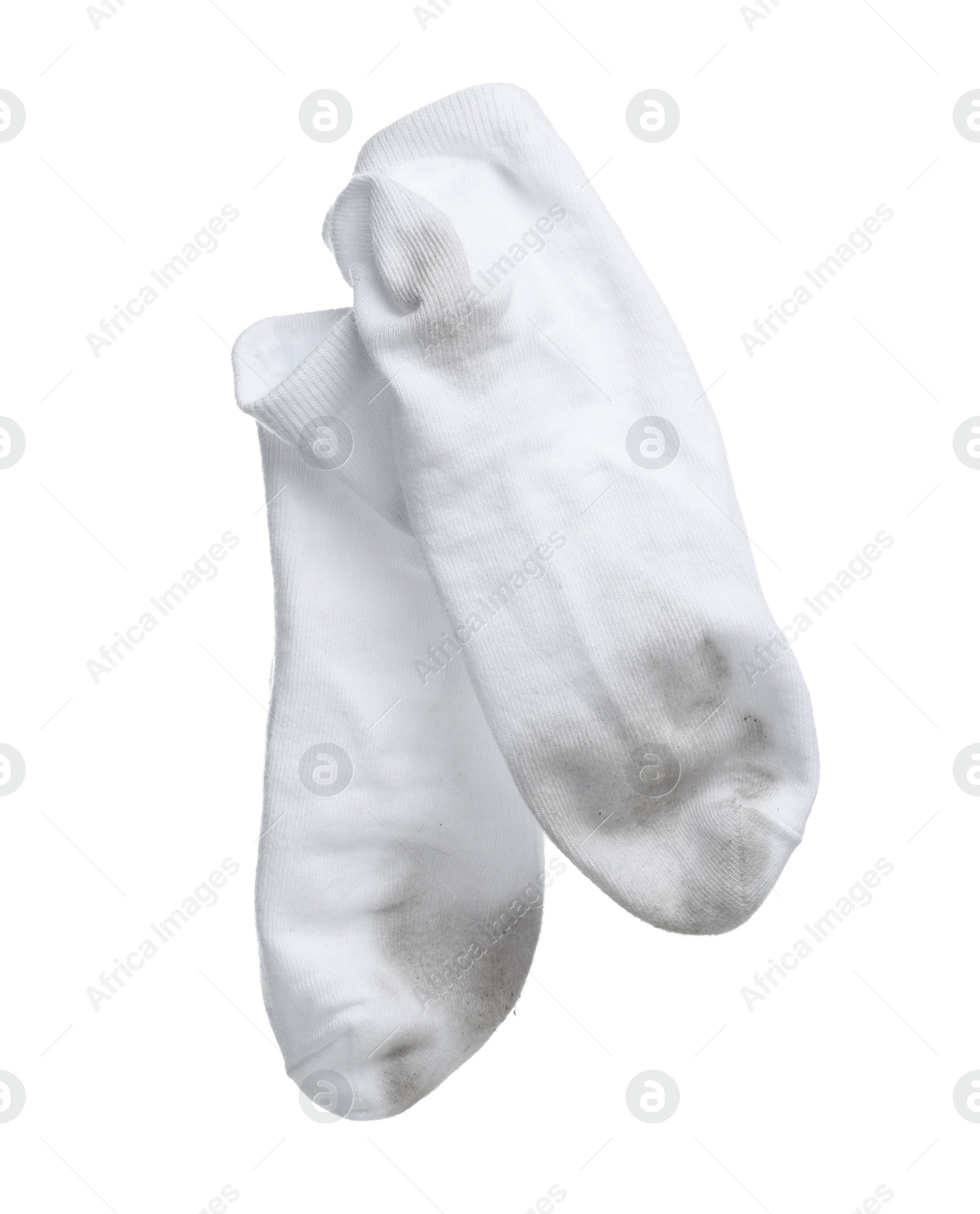 Photo of Pair of dirty socks on white background