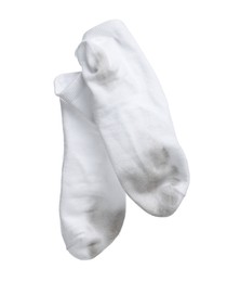 Photo of Pair of dirty socks on white background