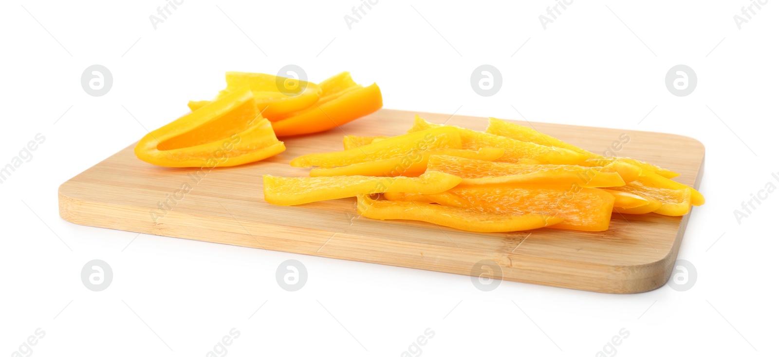 Photo of Cut fresh yellow bell peppers isolated on white