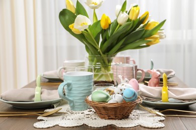 Photo of Festive table setting with beautiful flowers. Easter celebration