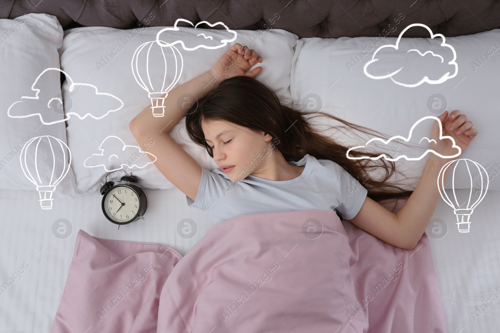 Image of Sweet dreams. Cute girl sleeping, above view. Hot air balloons and clouds illustrations on foreground