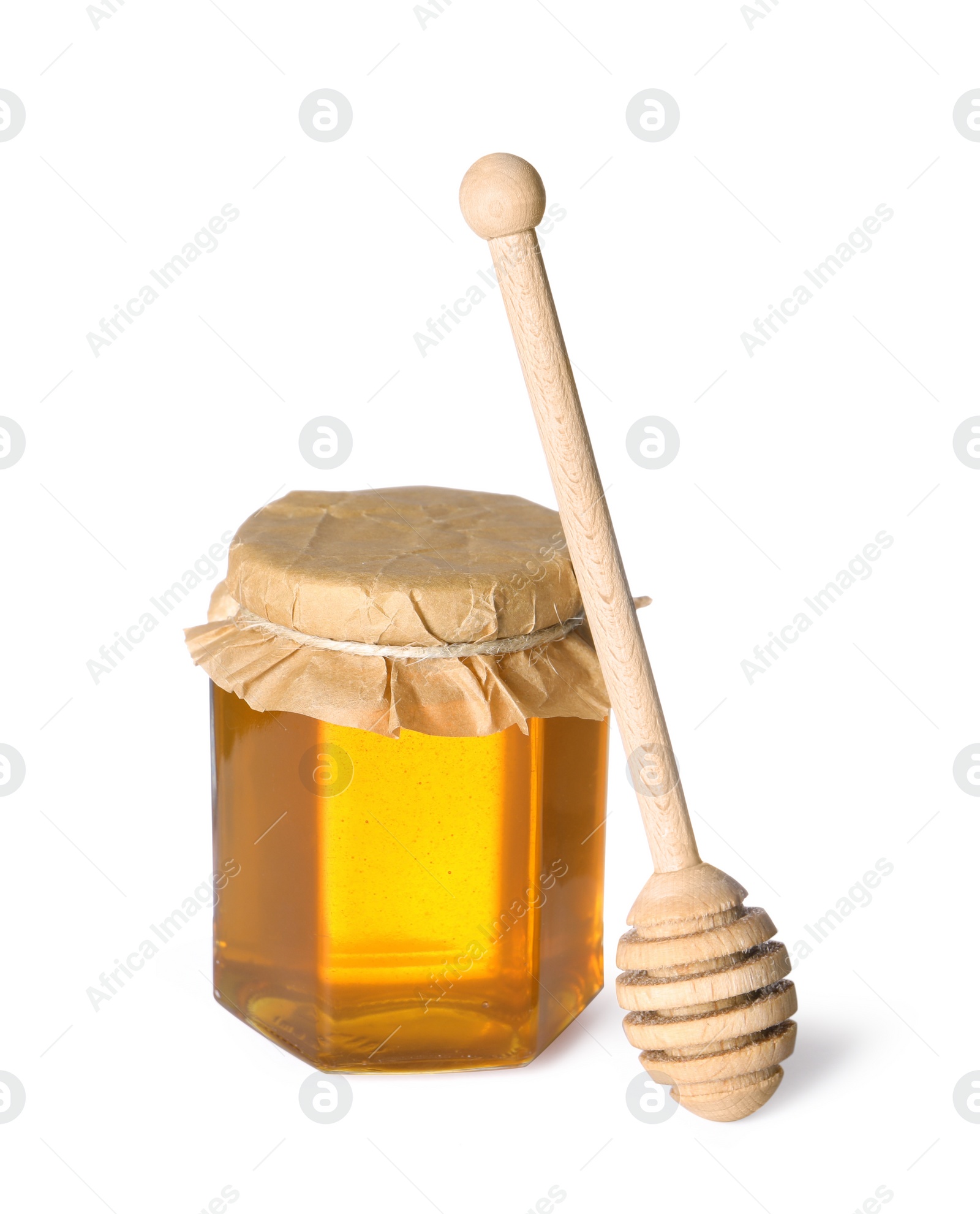 Photo of Tasty natural honey in glass jar and dipper isolated on white