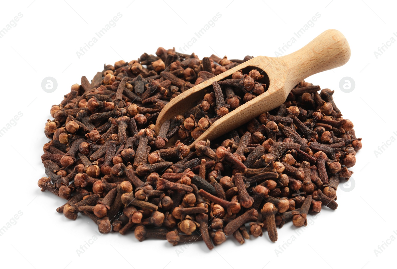 Photo of Pile of aromatic dry cloves and wooden scoop on white background