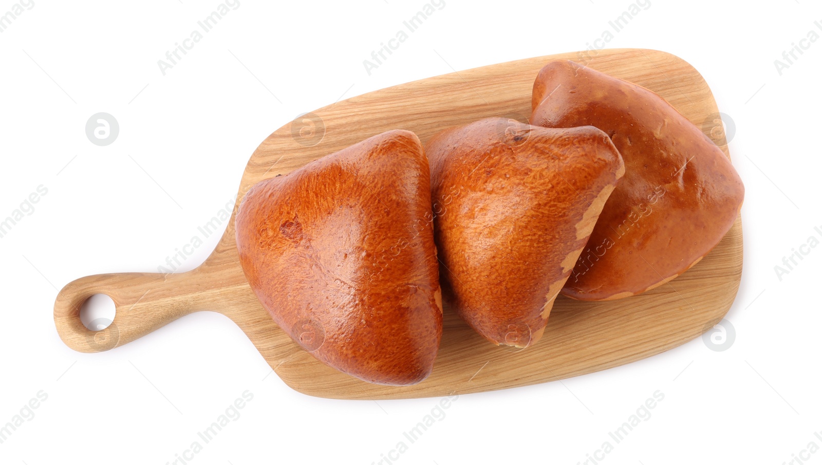 Photo of Wooden board with delicious baked patties on white background, top view