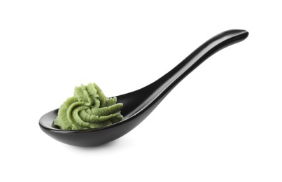 Photo of Ceramic spoon with swirl of wasabi paste isolated on white