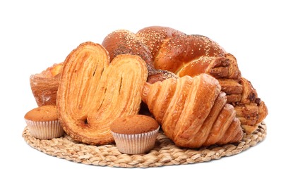 Wicker mat with different pastries isolated on white