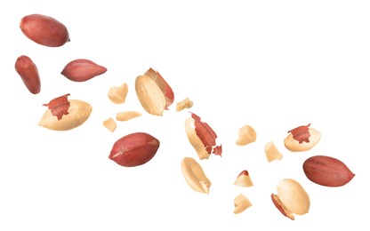 Image of Many peanuts in air on white background