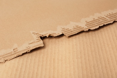 Photo of Corrugated cardboard as background, space for text. Recyclable material