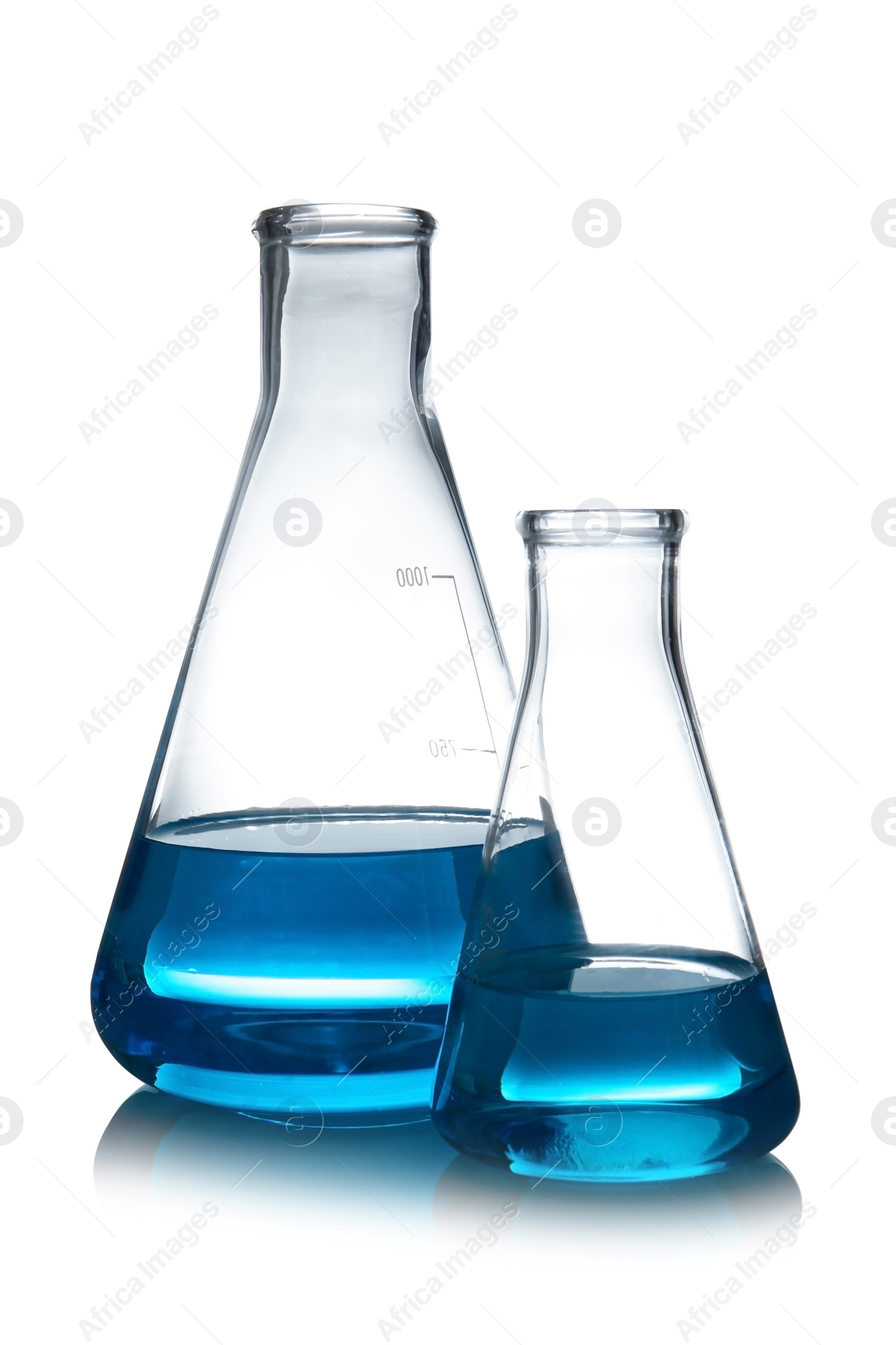 Photo of Conical flasks with liquid on table against white background. Laboratory analysis