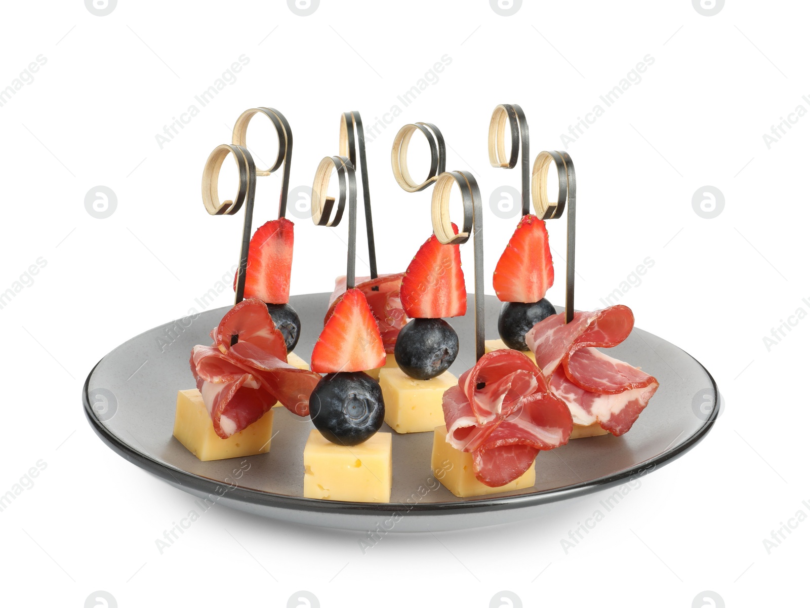 Photo of Plate with different tasty canapes isolated on white