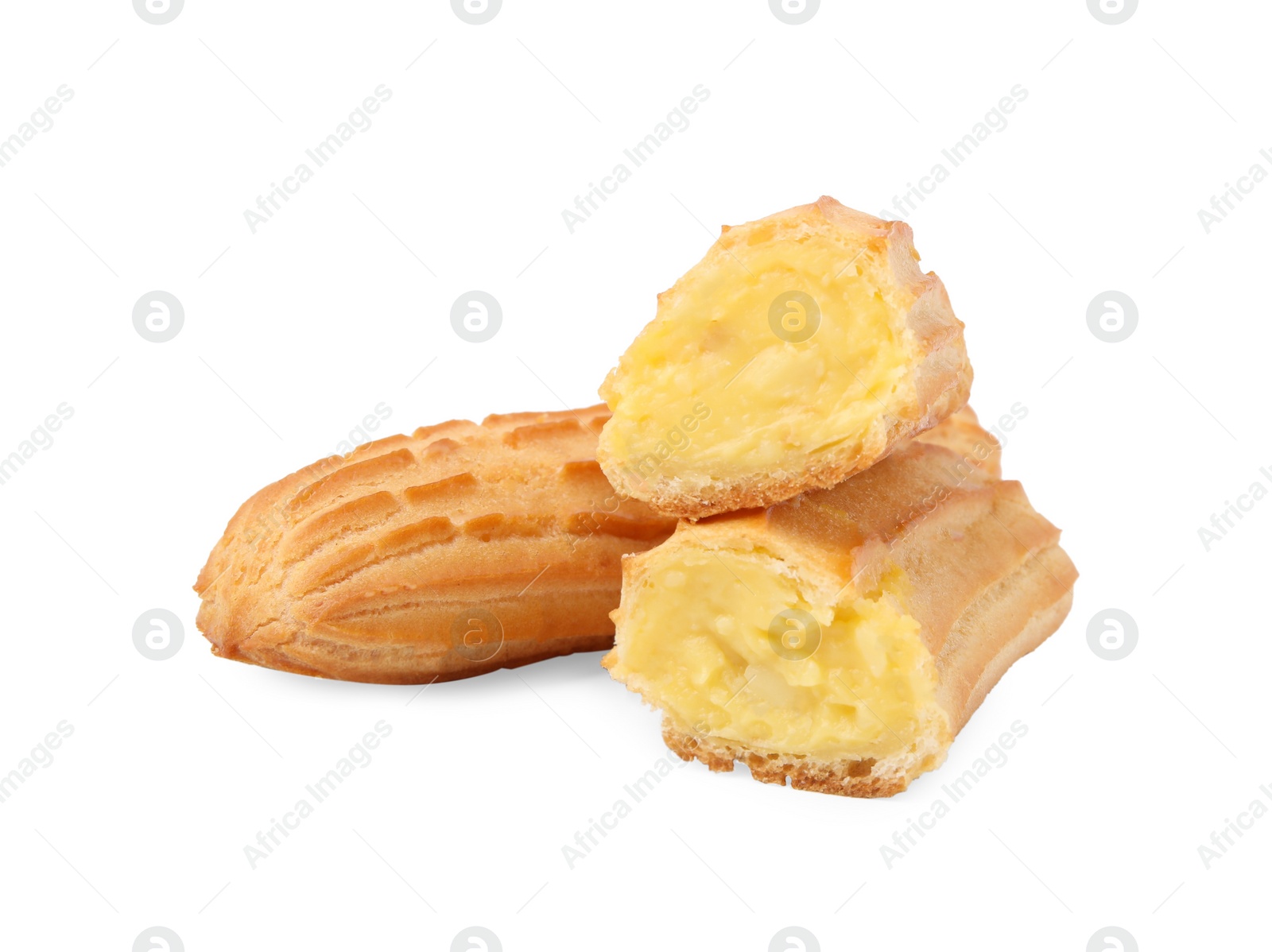 Photo of Cut and whole fresh delicious eclairs isolated on white