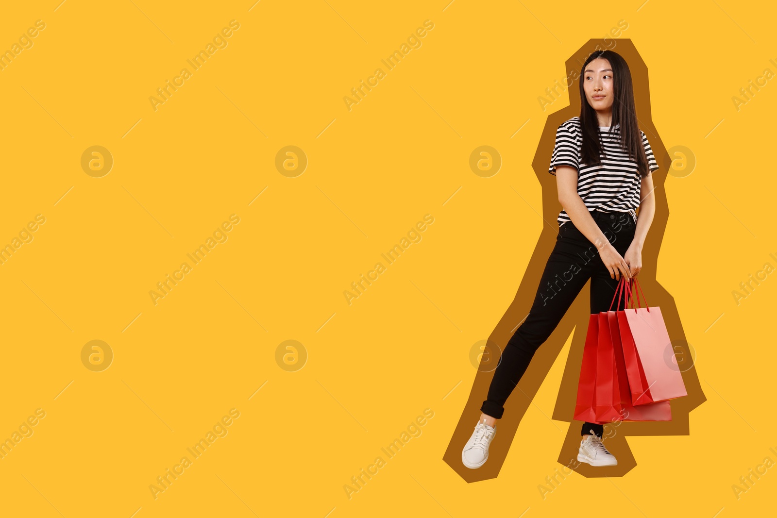 Image of Woman with shopping bags on orange background, space for text