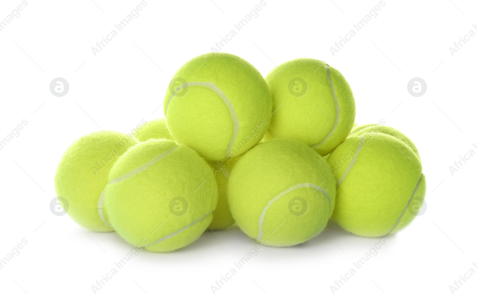 Photo of Heap of tennis balls on white background. Sports equipment