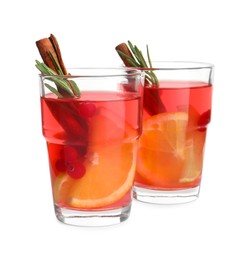 Photo of Glasses of aromatic punch drink isolated on white