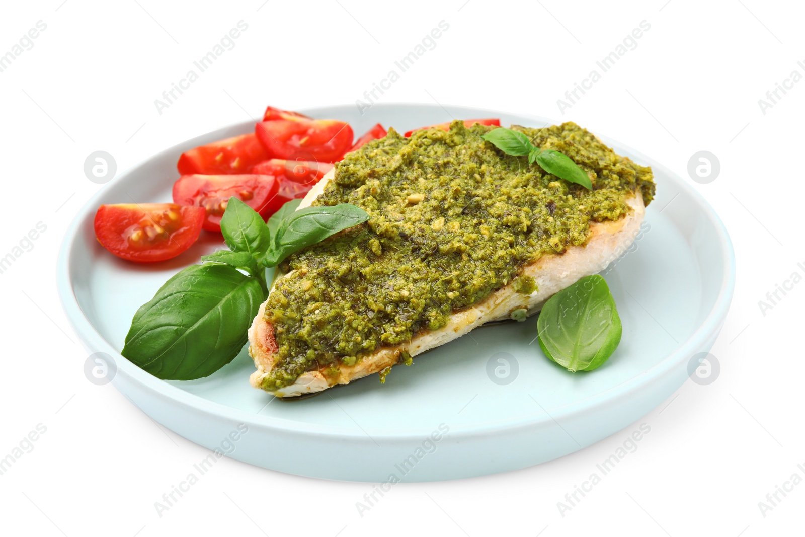 Photo of Delicious chicken breast with pesto sauce and basil isolated on white