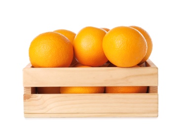 Photo of Wooden crate full of fresh oranges on white background