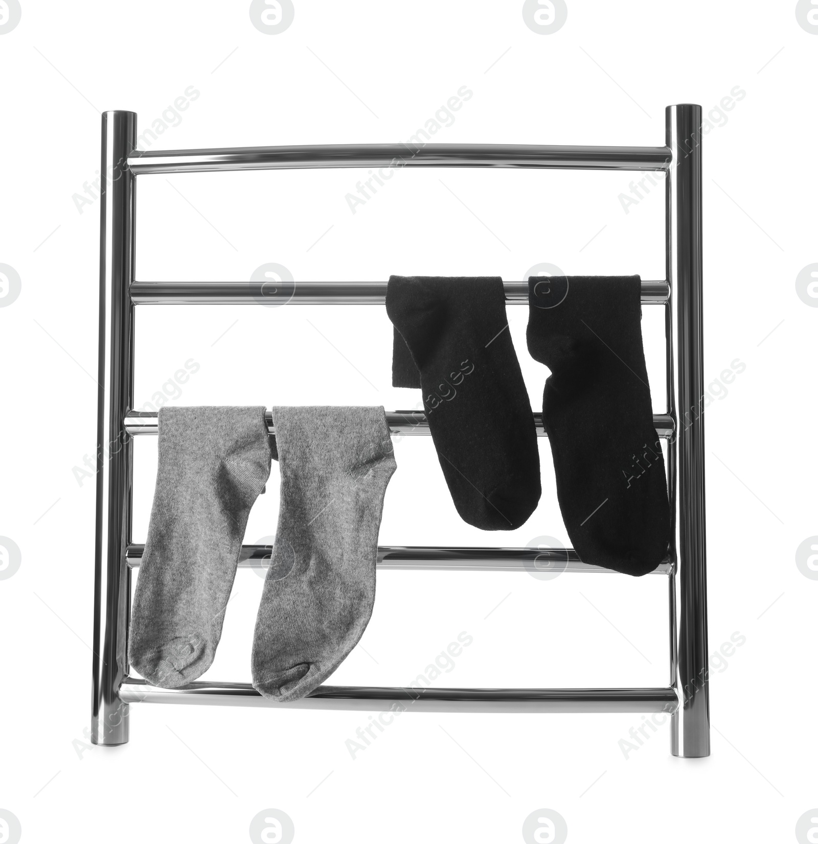 Photo of Modern heated towel rail with socks isolated on white