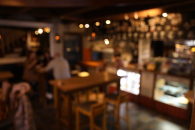 Photo of Blurred view of cafe interior with bokeh effect