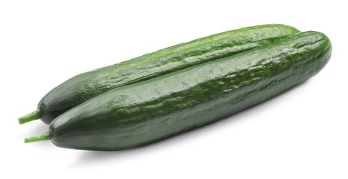 Photo of Two long fresh cucumbers isolated on white