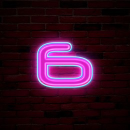 Image of Glowing neon number 6 sign on brick wall