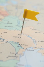 MYKOLAIV, UKRAINE - NOVEMBER 09, 2020: Kyiv city marked with push pin on political map Eastern Europe, closeup