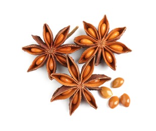 Photo of Dry anise stars with seeds on white background, top view