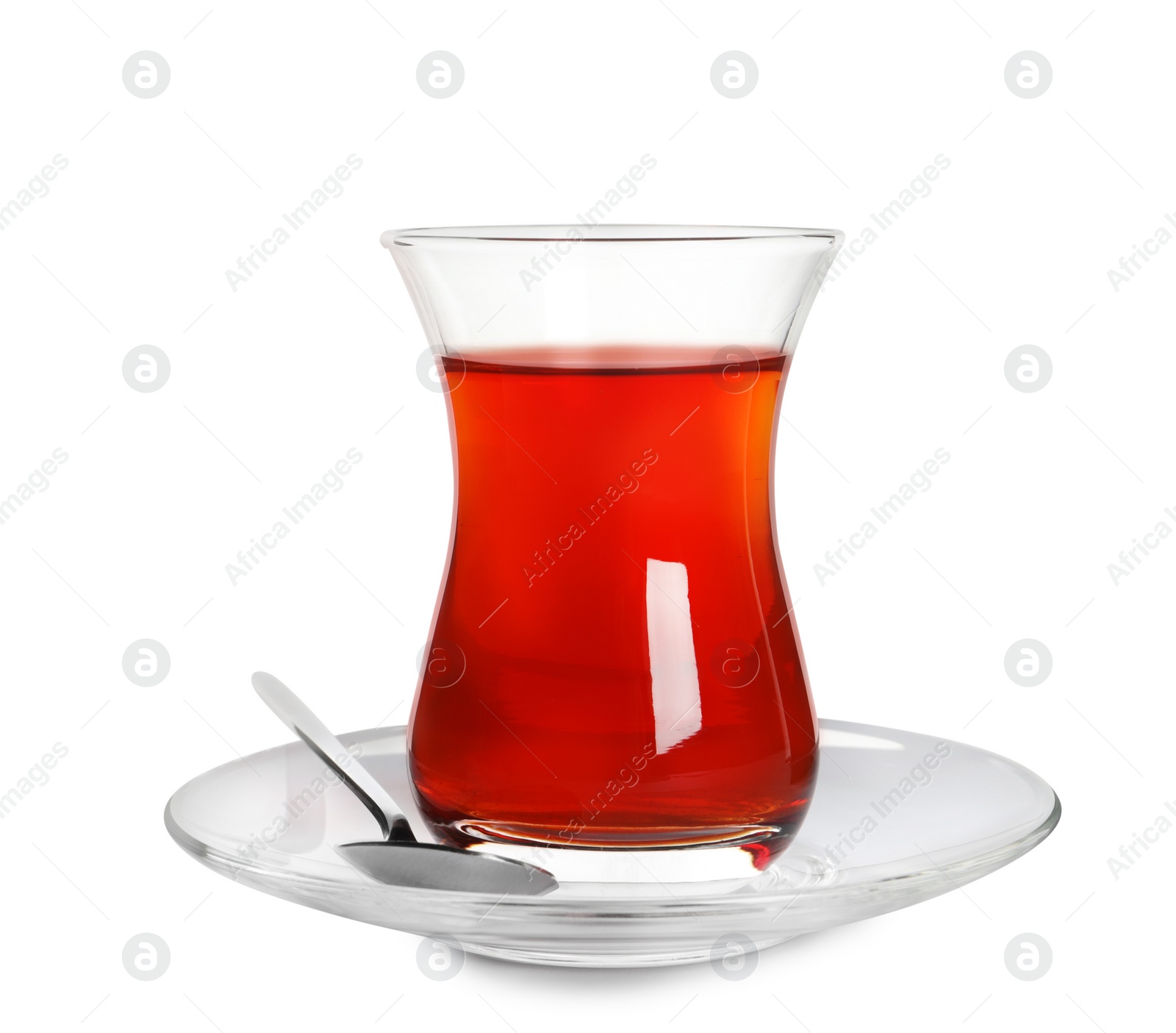 Photo of Glass of traditional Turkish tea with spoon isolated on white