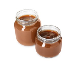 Photo of Baby food. Tasty healthy puree in jars isolated on white