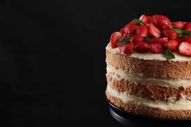 Tasty cake with fresh strawberries and mint on black background, closeup. Space for text