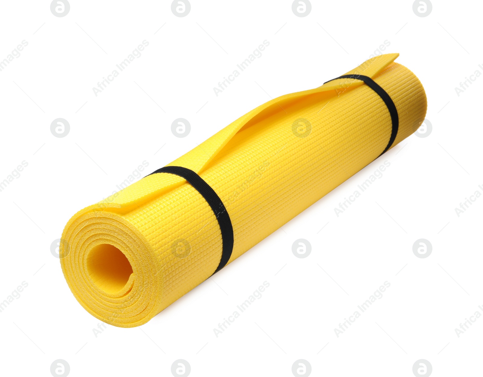 Photo of Rolled yellow camping mat isolated on white