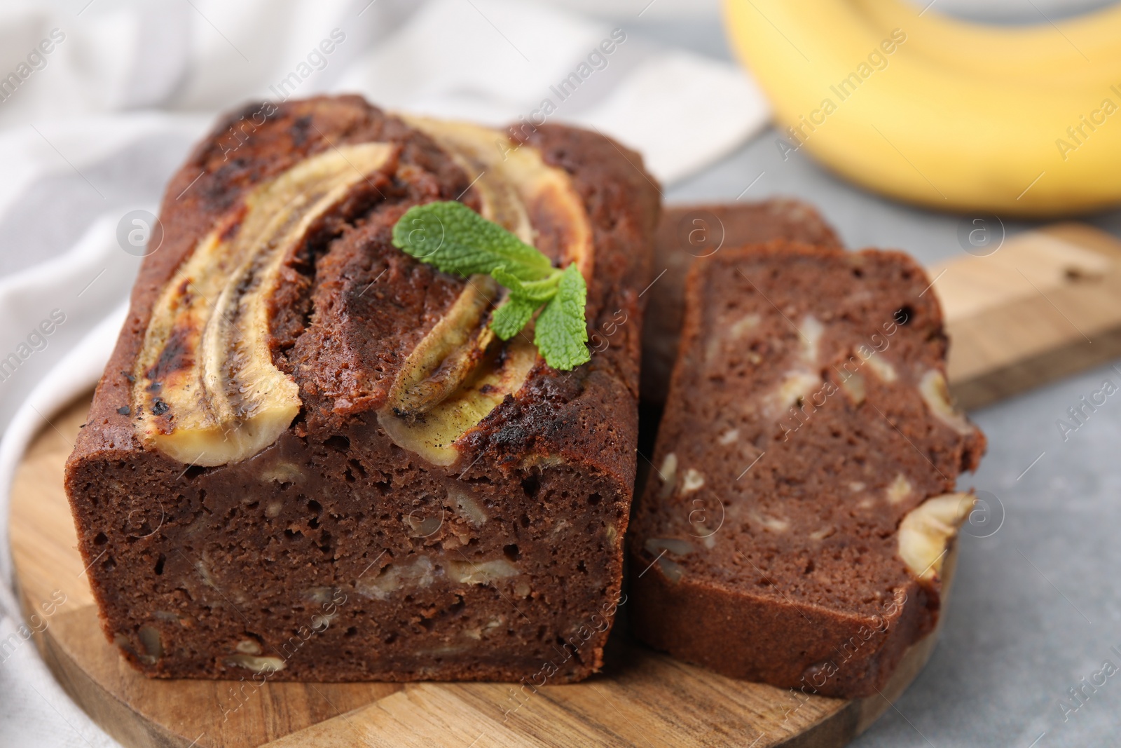 Photo of Delicious banana bread on grey table, closeup