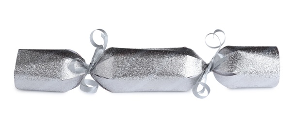 Photo of Shiny silver Christmas cracker isolated on white, closeup