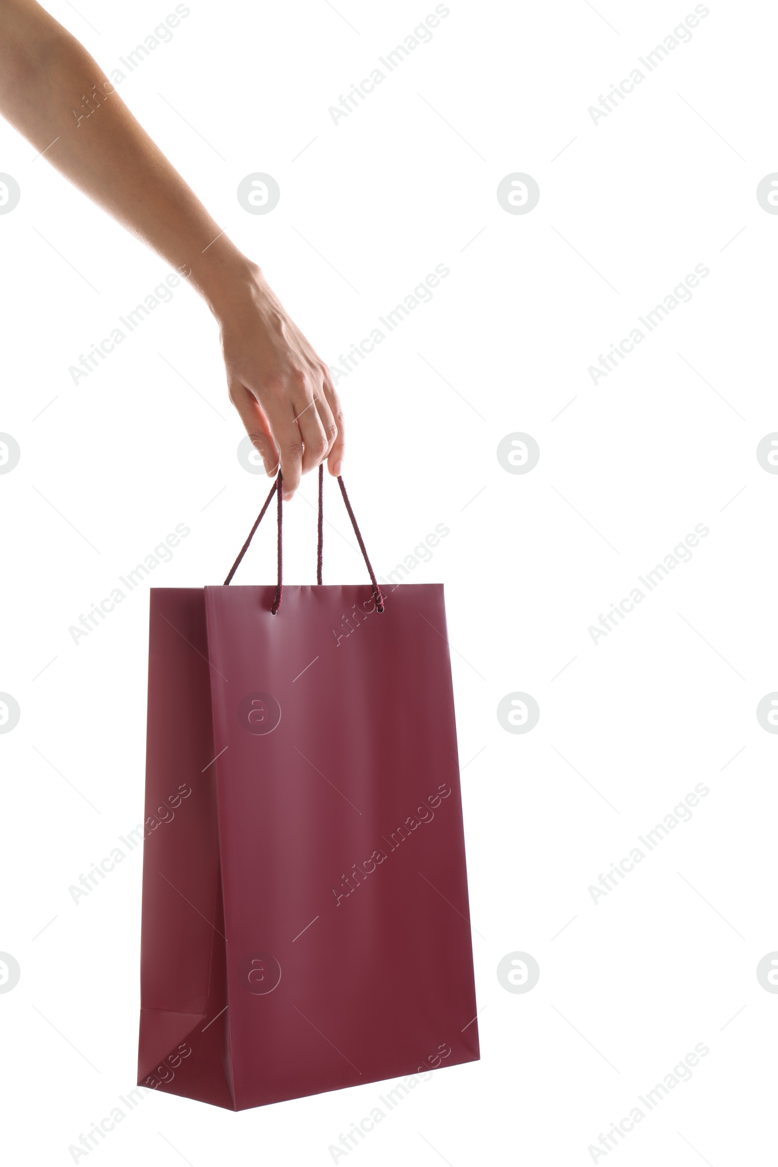 Photo of Woman with paper shopping bag on white background, closeup