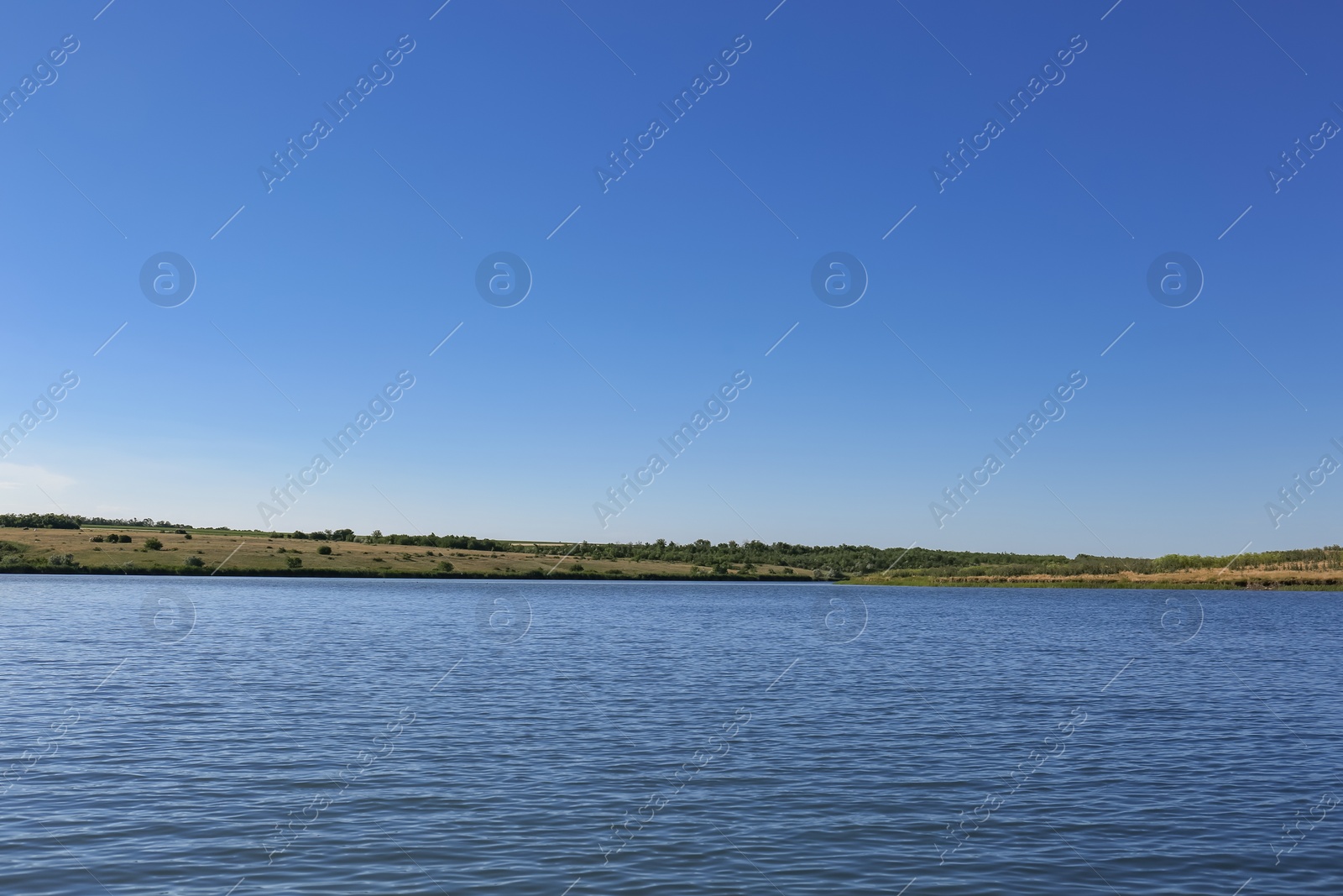 Photo of Beautiful landscape with calm river and green field