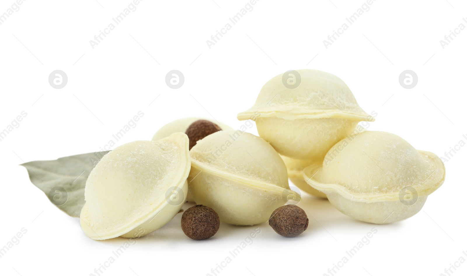 Photo of Raw meat dumplings with bay leaf on white background