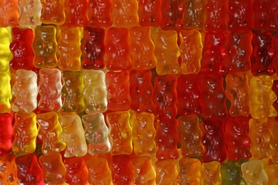 Many delicious jelly bears as background, top view